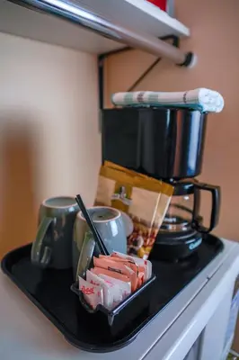 a black tray with a coffee pot on top of a stove at Thunderbird Motor Inn in Duncan