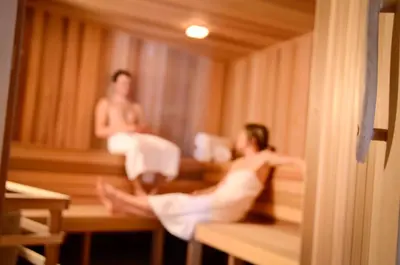 two people in a bath tub in a sauna at Tyax Lodge & Heliskiing in Gold Bridge