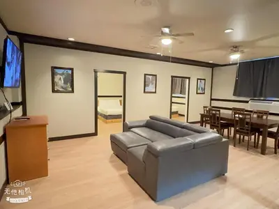 a living room with a couch and a dining room at Wells Gray Inn in Clearwater
