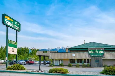 a sign for a restaurant in front of a building at Sandman Inn McBride in McBride