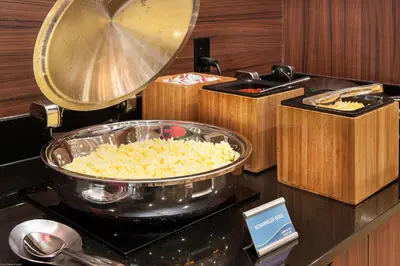 a counter with a pan of food on a stove at Fairfield Inn & Suites by Marriott Vernon in Vernon