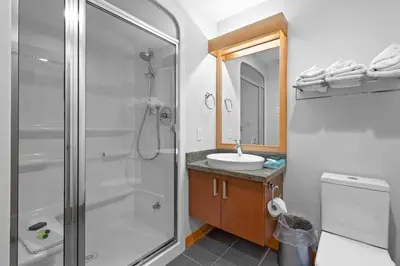 a bathroom with a shower and a sink at Kookaburra Lodge #203 By Bear Country in Sun Peaks