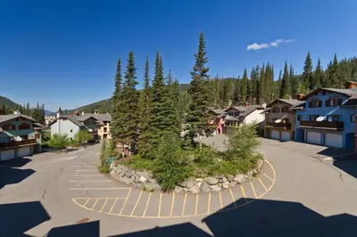 arial view of a town with trees and buildings at Snow Creek Village #20 By Bear Country in Sun Peaks