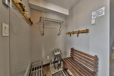 a room with a bench in a building at Stones Throw #56 By Bear Country in Sun Peaks
