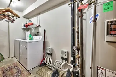 a room with a water heater and aperature at Trappers Landing #11 By Bear Country in Sun Peaks