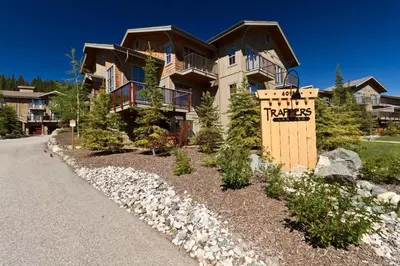a large house with a sign in front of it at Trappers Landing #05 By Bear Country in Sun Peaks