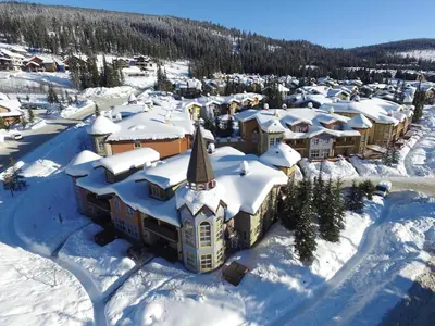 an aerial view of a town covered in snow at Crystal Forest #54 By Bear Country in Sun Peaks