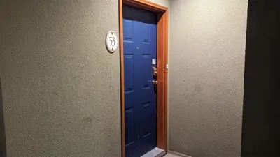a blue door in a room with a mirror at Crystal Forest #53 By Bear Country in Sun Peaks