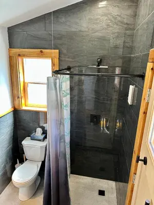 a bathroom with a shower and a toilet at Garden Bay Hideaway - Glamping & RV in Garden Bay