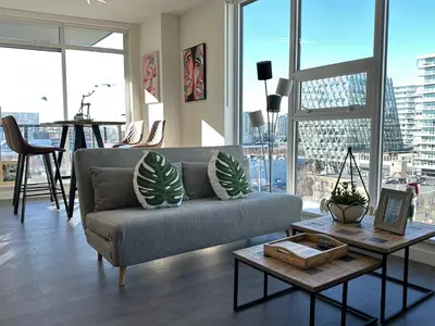 a living room with a couch and a table at Gorgeous Place In Downtown RMD in Richmond