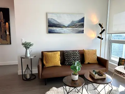 a living room with a couch and a table at Gorgeous Place In Downtown RMD in Richmond