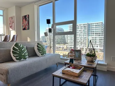 a living room with a couch and a table at Gorgeous Place In Downtown RMD in Richmond