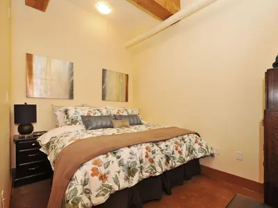 a bedroom with a large bed in a room at Gorgeous Luxury 2 Bedroom 2 Bath Condo In Old Town Victoria in Victoria