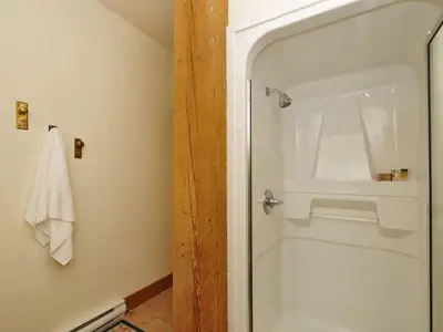 a shower with a glass door in a bathroom at Gorgeous Luxury 2 Bedroom 2 Bath Condo In Old Town Victoria in Victoria