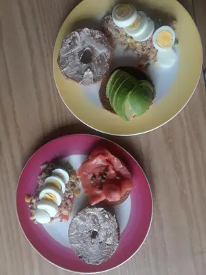 two plates with different types of food on them at Vancouver Traveller B&B in Vancouver