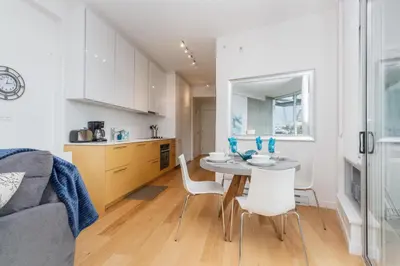 a kitchen and dining room with a table and chairs at Enjoy The Waterway Action At Your Doorstep in Victoria