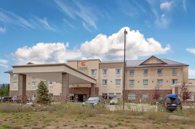 a hotel with a car parked in front of it at Comfort Inn & Suites in Valemount