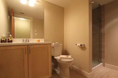 a bathroom with a toilet and a sink and a shower at Villas Snowberry by Whistler Retreats in Whistler