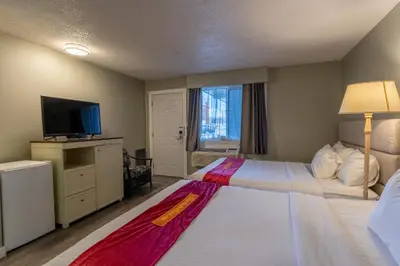 a hotel room with a bed and a television at Ace Motel in Princeton