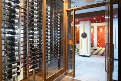 a wine cellar with a wall of wine bottles at Four Points by Sheraton Edmonton International Airport in Nisku