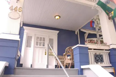 a toy house with a flag on the front of it at Cambie Lodge in Vancouver