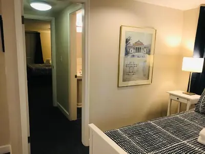 a hotel room with a bed and a picture on the wall at Cambie Lodge in Vancouver