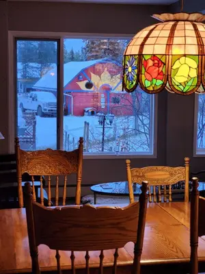 a room with two chairs in front of a window at Hidden Valley Bed and Breakfast in Whitehorse