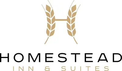 a logo for homesaced in and suites at Homestead Inn & Suites in Vanderhoof