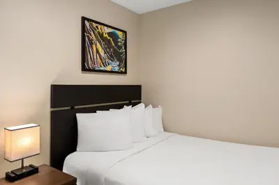 a hotel room with a bed and a lamp at Worldmark Whistler Sundance in Whistler