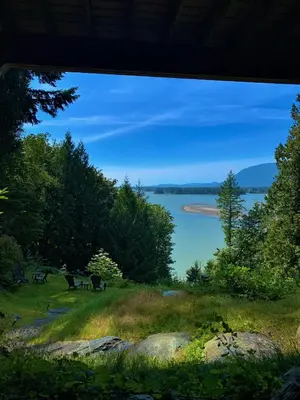 a view of a lake from a window at The Fraser River's Edge B&B Lodge in Chilliwack