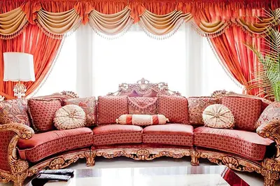 a living room with a red couch in front of a window at Harmony House in Richmond