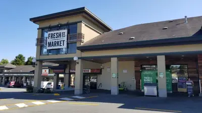a shopping center with a garage market sign on it at Hannah's Heavenly Home in Surrey