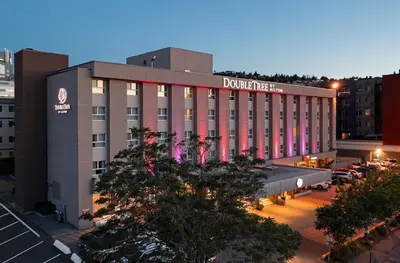 a building with a sign on the side of it at DoubleTree by Hilton - Kamloops in Kamloops