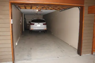 a car is parked inside of a garage at Woodhaven # 8 in Sun Peaks in Sun Peaks