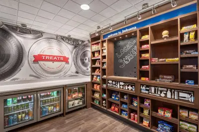 a grocery store aisle with food and beverages at Hampton Inn & Suites Kelowna, British Columbia, Canada in Kelowna