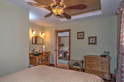 a bedroom with a bed and a ceiling fan at Country Encounters Accommodations in Coleman