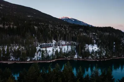an aerial view of a mountain and a lake at Basecamp Resorts Revelstoke in Revelstoke