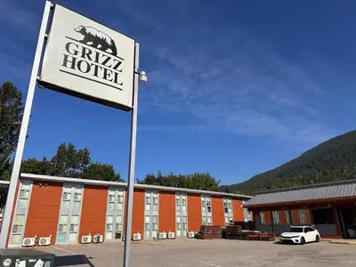 a sign for a hotel in front of a building at Grizz Hotel in Revelstoke
