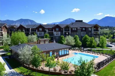 an aerial view of a home with a swimming pool at Rustic Modern 2 Bed 2 Bath with Lakeview Pool and Hot Tub in Invermere