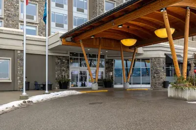 a building with awning in front of a building at Four Points by Sheraton Kelowna Airport in Kelowna