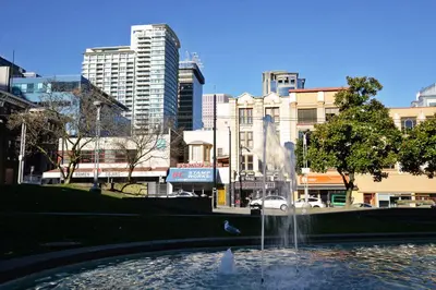 a fountain in the middle of a city with buildings at Vancouver Hideaway Guesthouse in Vancouver