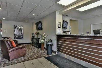 a bar in a waiting room with a chair at The View Hotel in Fort Saint James