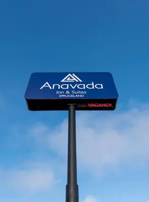 a sign for an amexacosa truck and shuttle at Anavada Inn & Suites - Prince George in Prince George