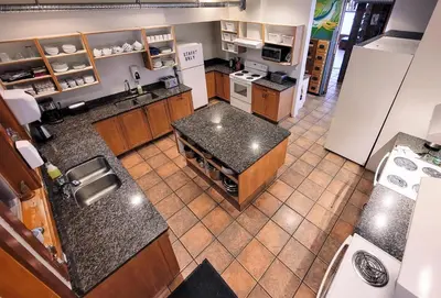 an overhead view of a kitchen with a counter top at Whalers Guesthouse in Tofino