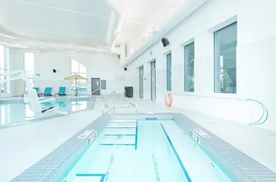 an empty swimming pool in a building at Hyatt Place Kelowna in Kelowna