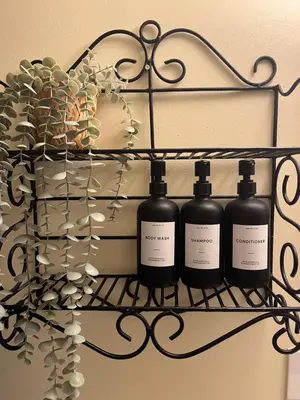 a rack with three bottles of wine on it at Wildflower Suite in Whistler