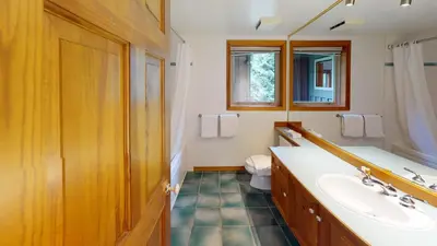 a bathroom with a sink and a toilet at Painted Cliff by Whistler Premier in Whistler