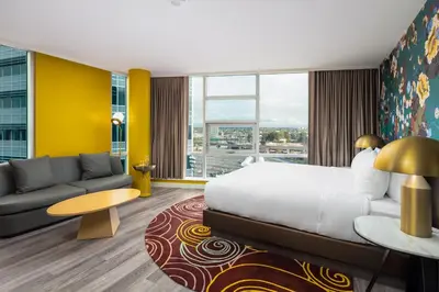 a hotel room with a bed and a couch at Versante Hotel in Richmond