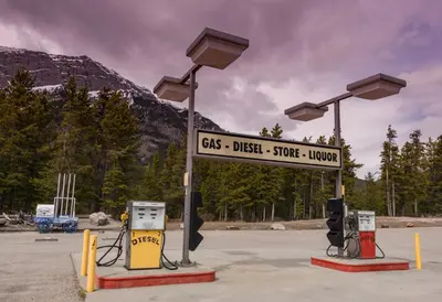 a gas station with a sign that reads cbs diesel storelower at David Thompson Resort in Cline River