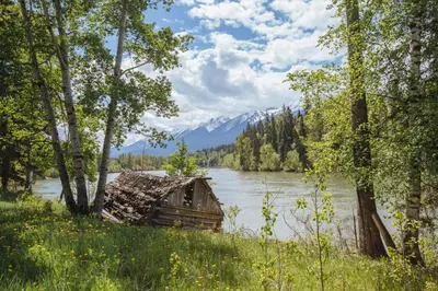an old cabin on the shore of a lake at Terracana Ranch Resort in Tete Jaune Cache